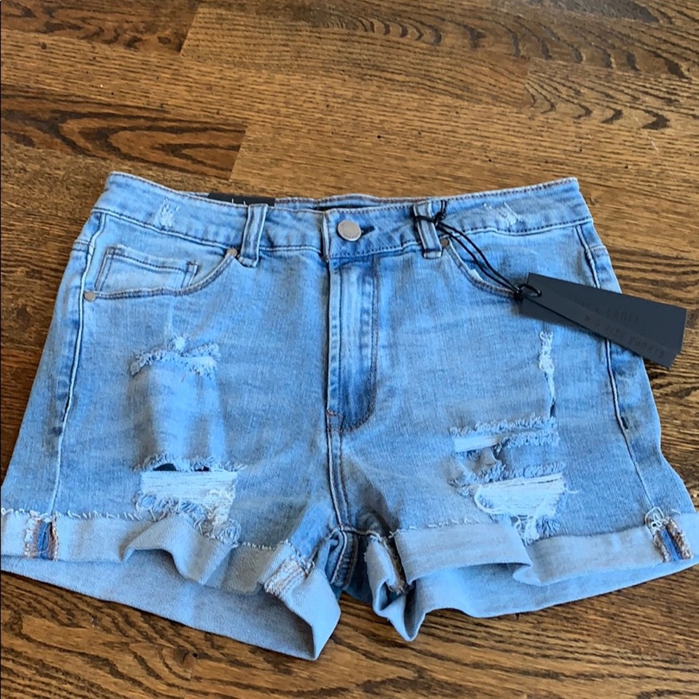 Distressed mid rise cuffed denim shorts